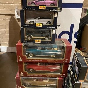 Assorted die cast model maisto cars in original packaging never been opened.